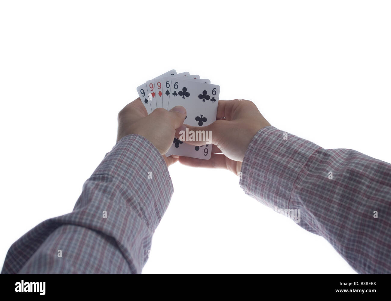 man hands holding full house on poker game over white Stock Photo