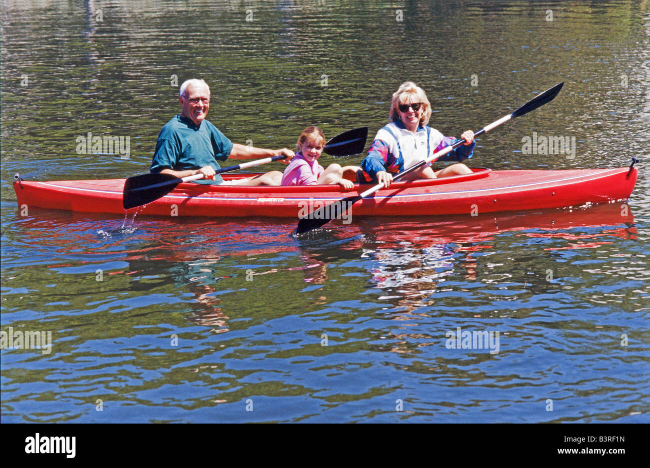 Grandmother and grandkids, kayaking together in park, Miami. Stock Photo