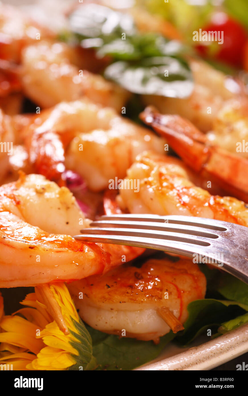 Skewers of cooked shrimp on dinner plate Stock Photo Alamy