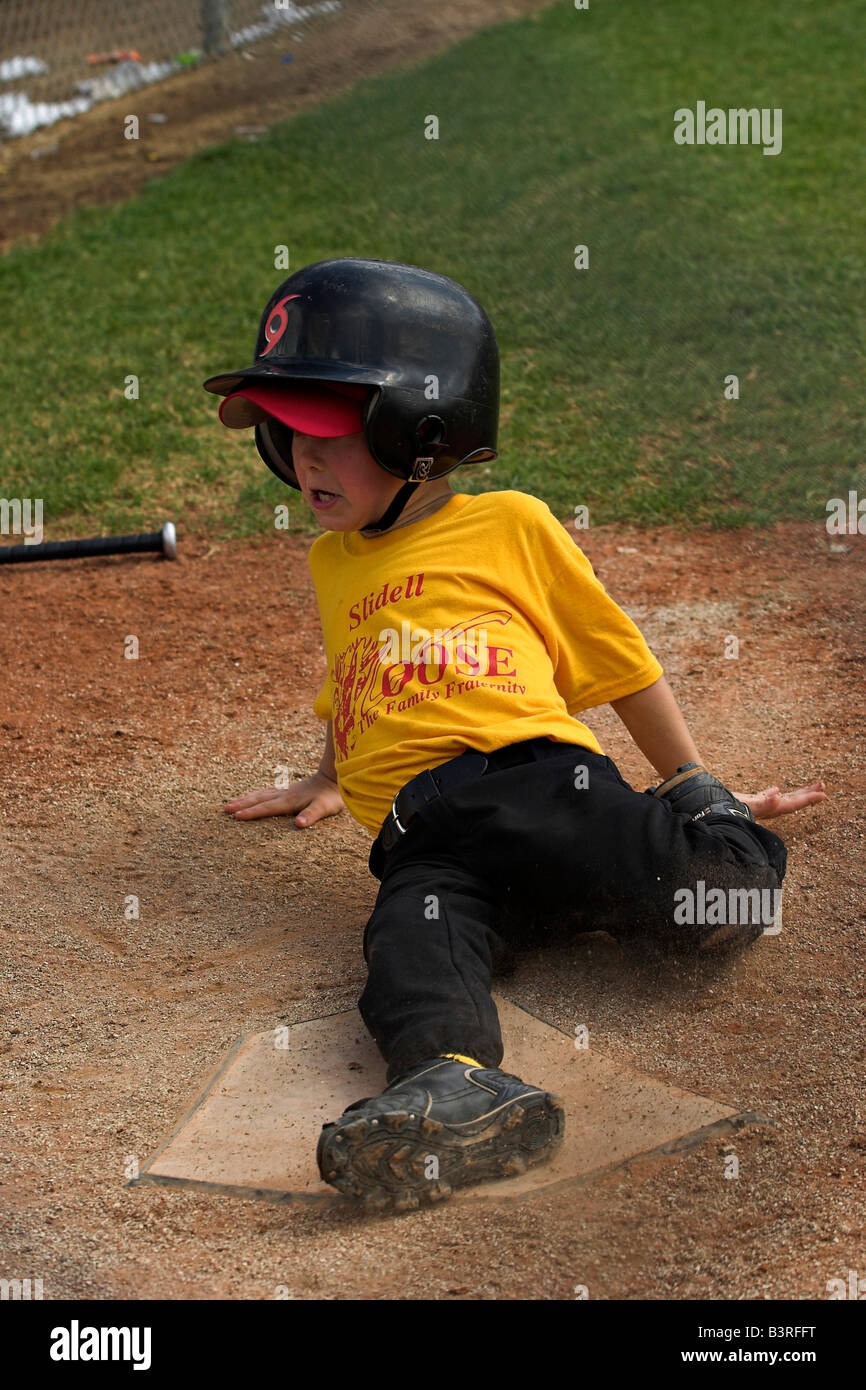 A little league baseball player slides into home Stock Photo Alamy