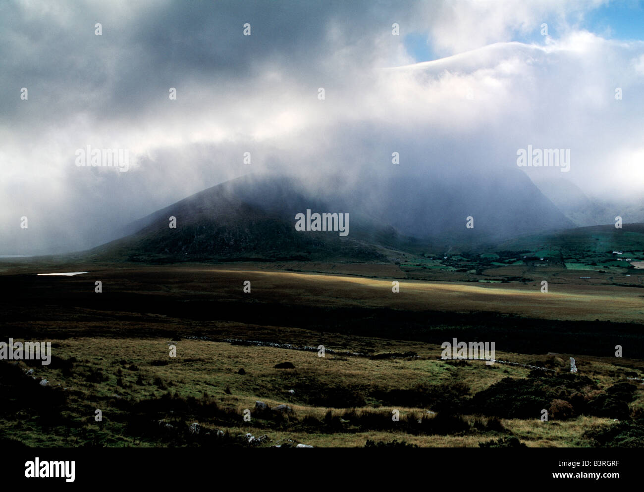 irelands second highest mountain range covered in cloud mist rain, heavens reflexes, weather