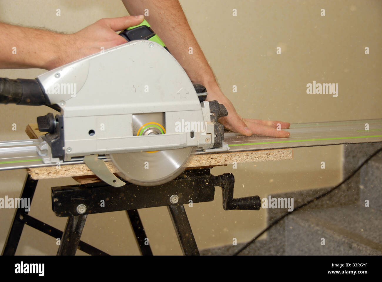 https://c8.alamy.com/comp/B3RGYF/carpenter-hand-and-saw-in-time-of-work-B3RGYF.jpg