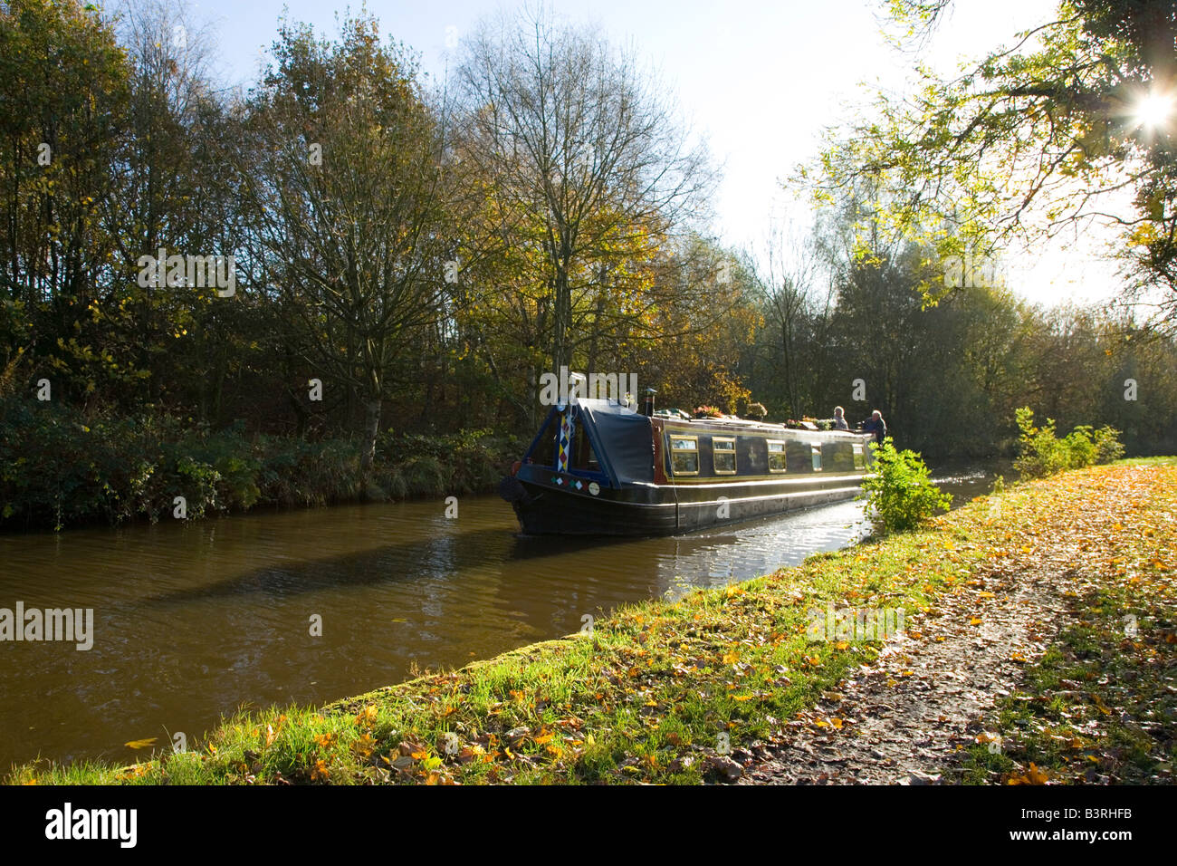 A Narrowboat Travelling along the Macclesfield Canal near Marple Stock