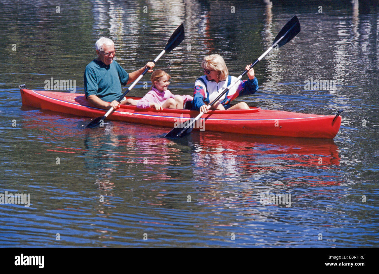 Grandmother and grandkids, kayaking together in park, Miami. Stock Photo