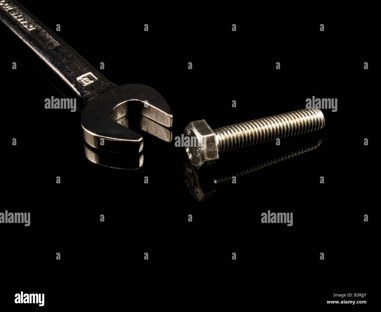 Spanner and Bolt on Black Background Stock Photo Alamy