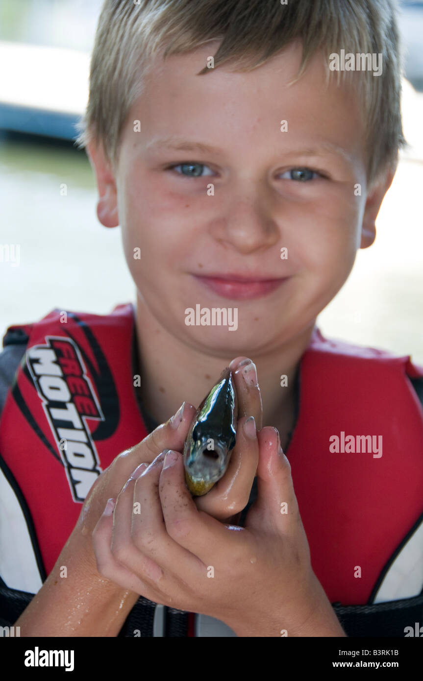 Oh!, Surprised first catch, for the boy and the fish. Stock Photo