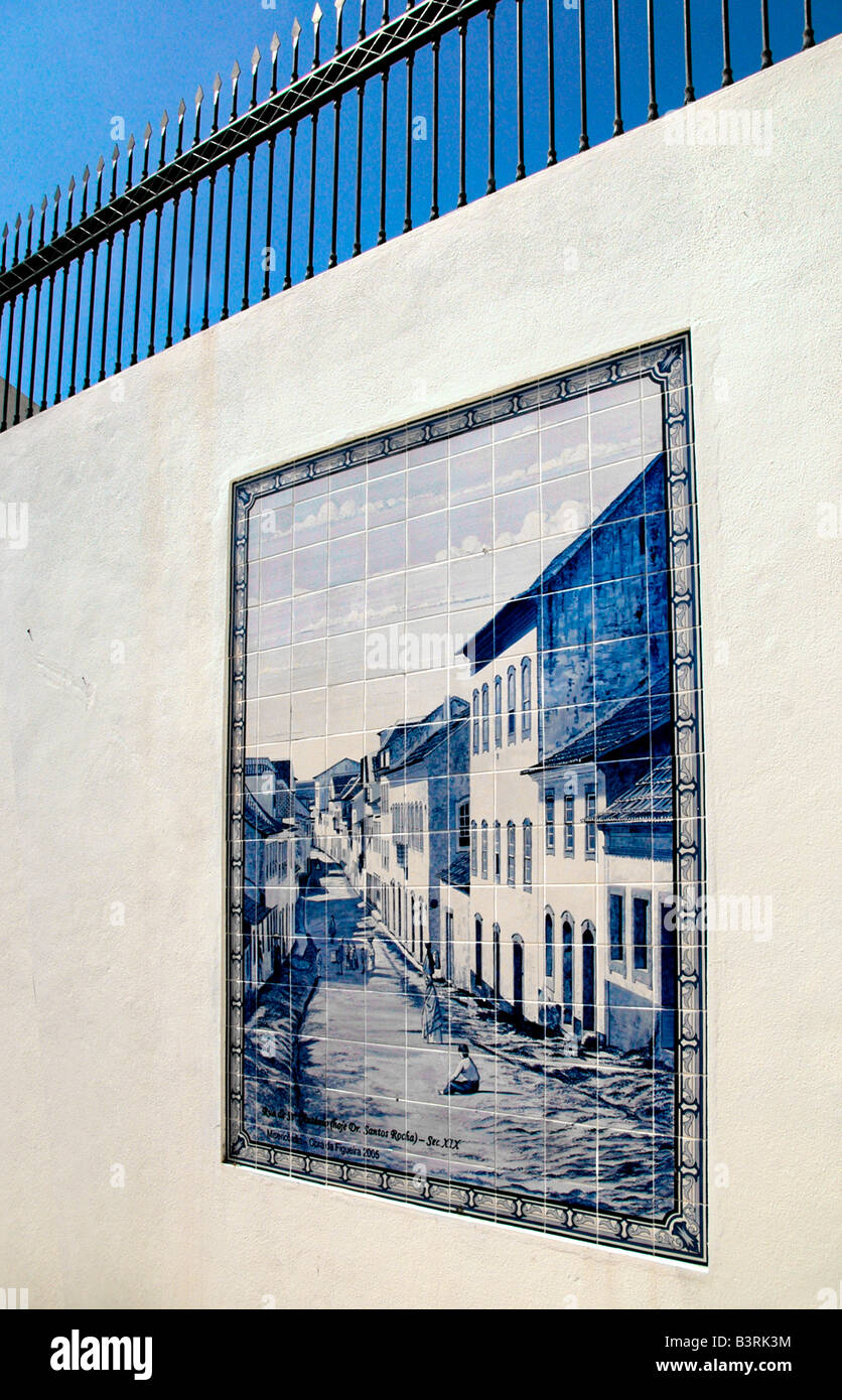 a tiled mural of an old street scene on a street wall in the town of Figueira da foz, Portugal. Stock Photo