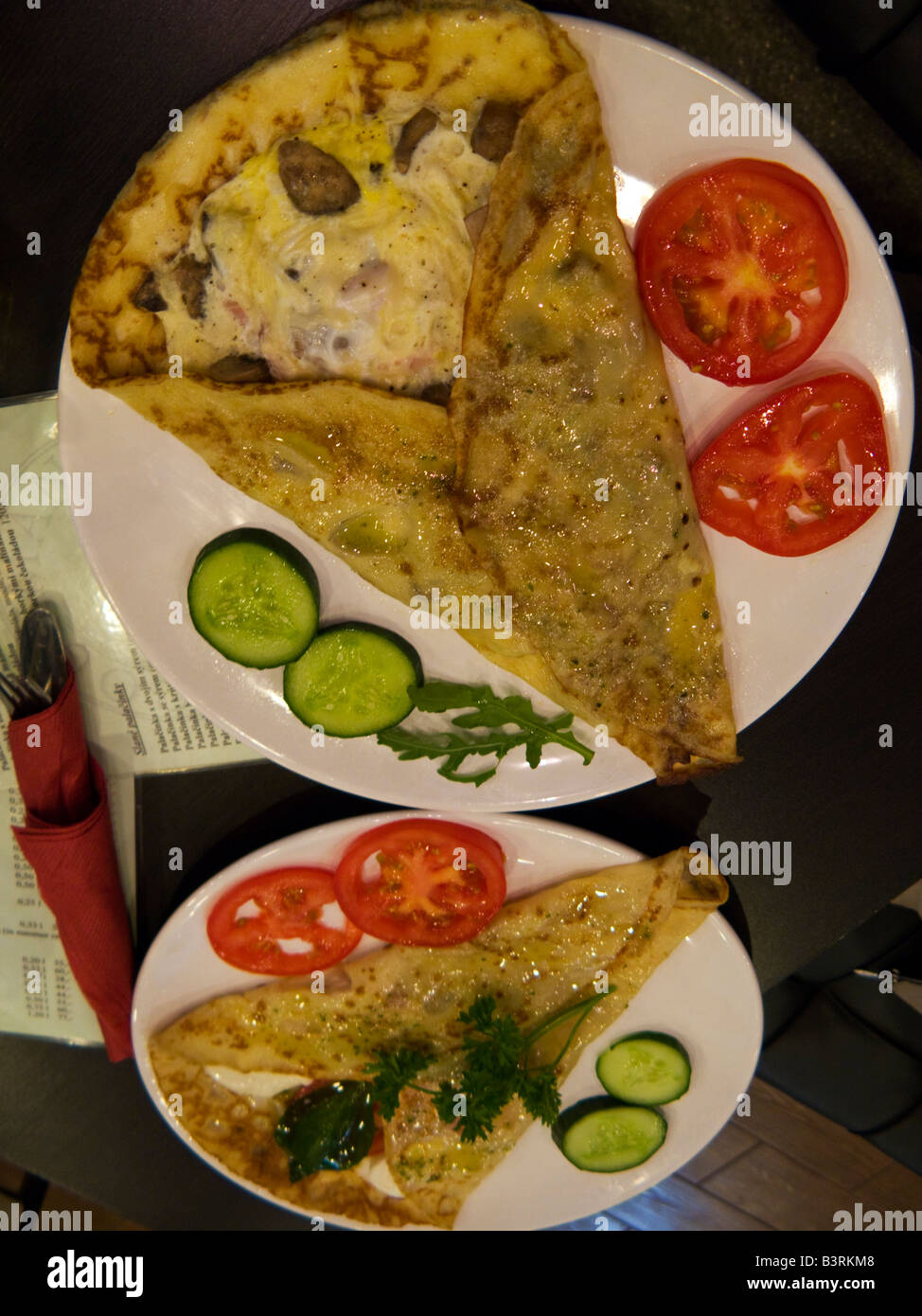 Two plates of pancakes with mushrooms Prague Czech Republic Stock Photo
