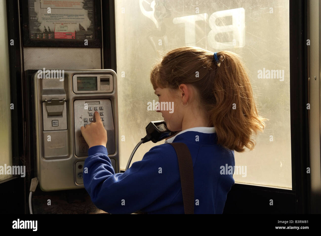 Child using callbox telephoning from a payphone which BT tend to remove ...