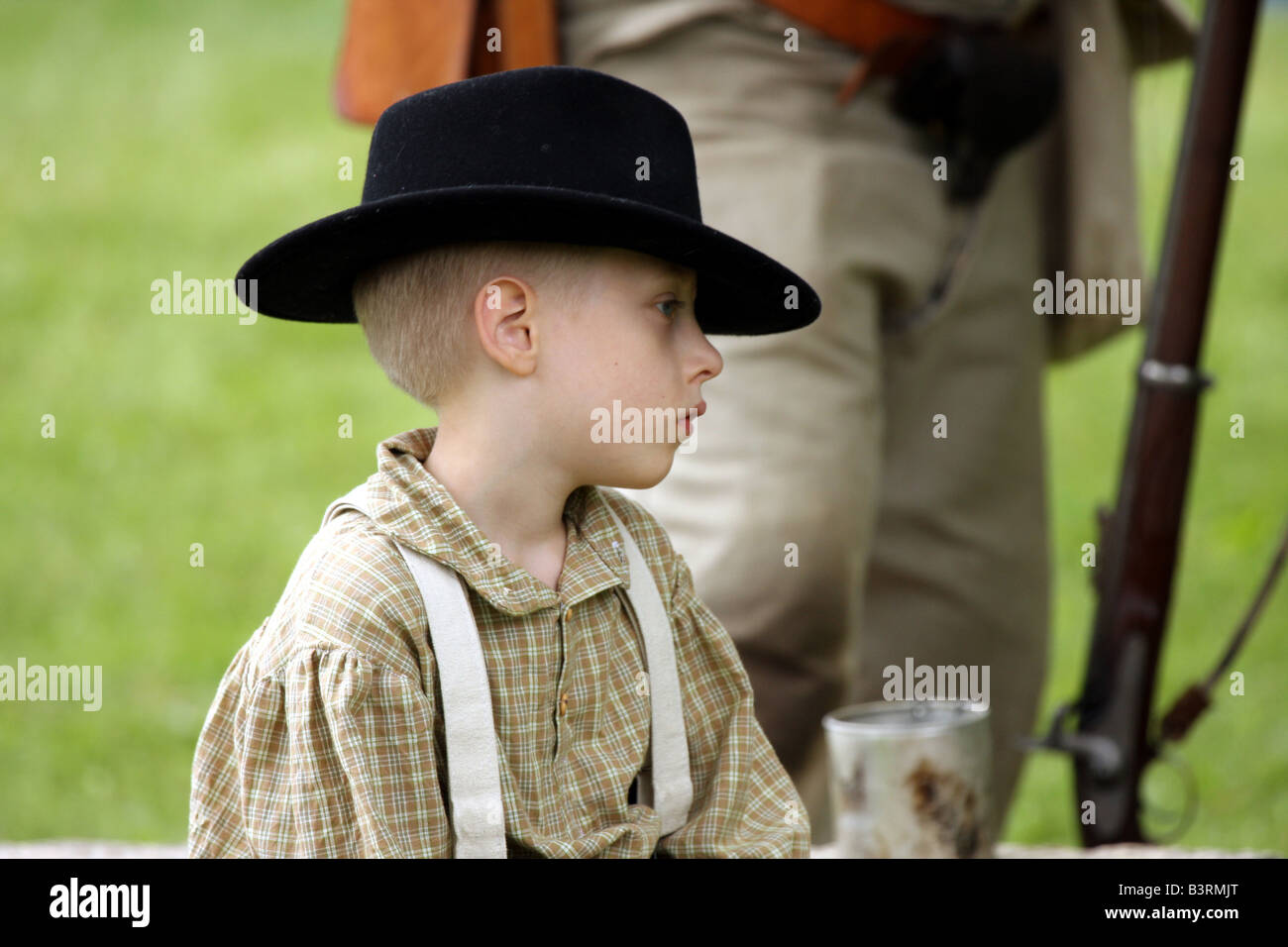 A boy in an 1850s outfit at a Civil War Encampment Reenactment Stock Photo