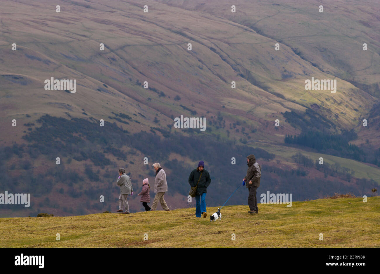 Senior couple and young child walking on Mynydd Illtyd Common near