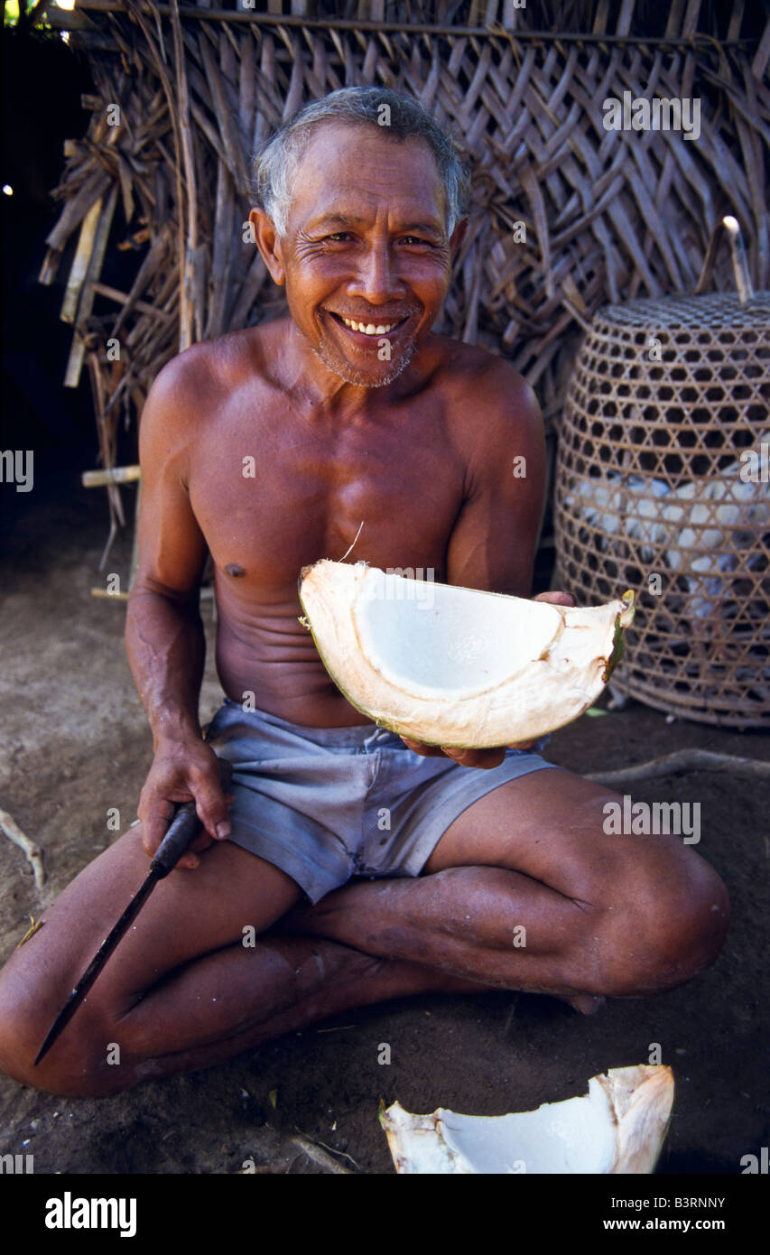 Farmer with green coconut, Bali Stock Photo