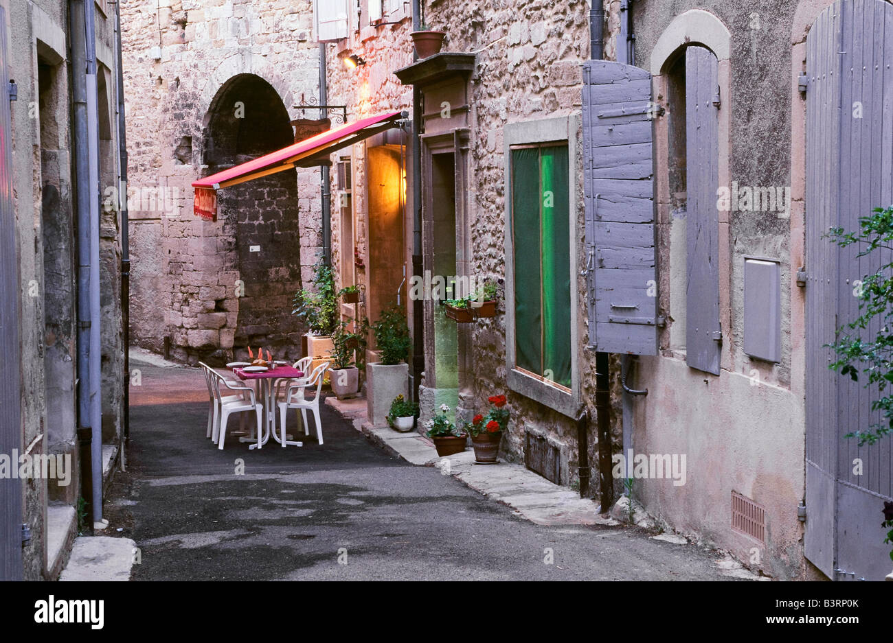 Tables and chairs on small street, Grignan, Provence, France Stock Photo