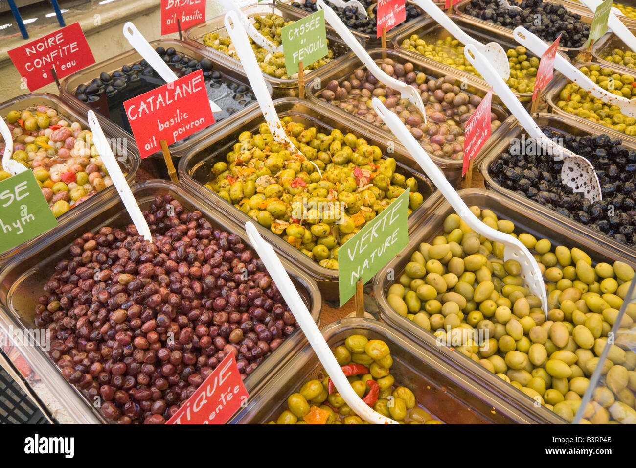 A variety of olives is being offered at a market stall at Céret in