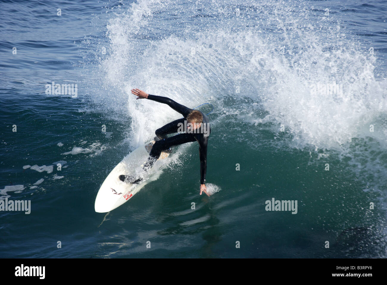 A surfer performing a cutback at Steamer's Lane in Santa Cruz