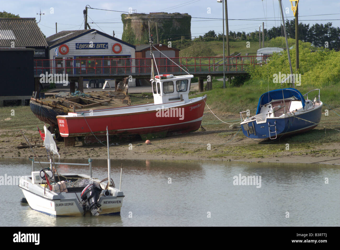 red short fishing boat scallop grounded low tide rye east sussex Stock Photo