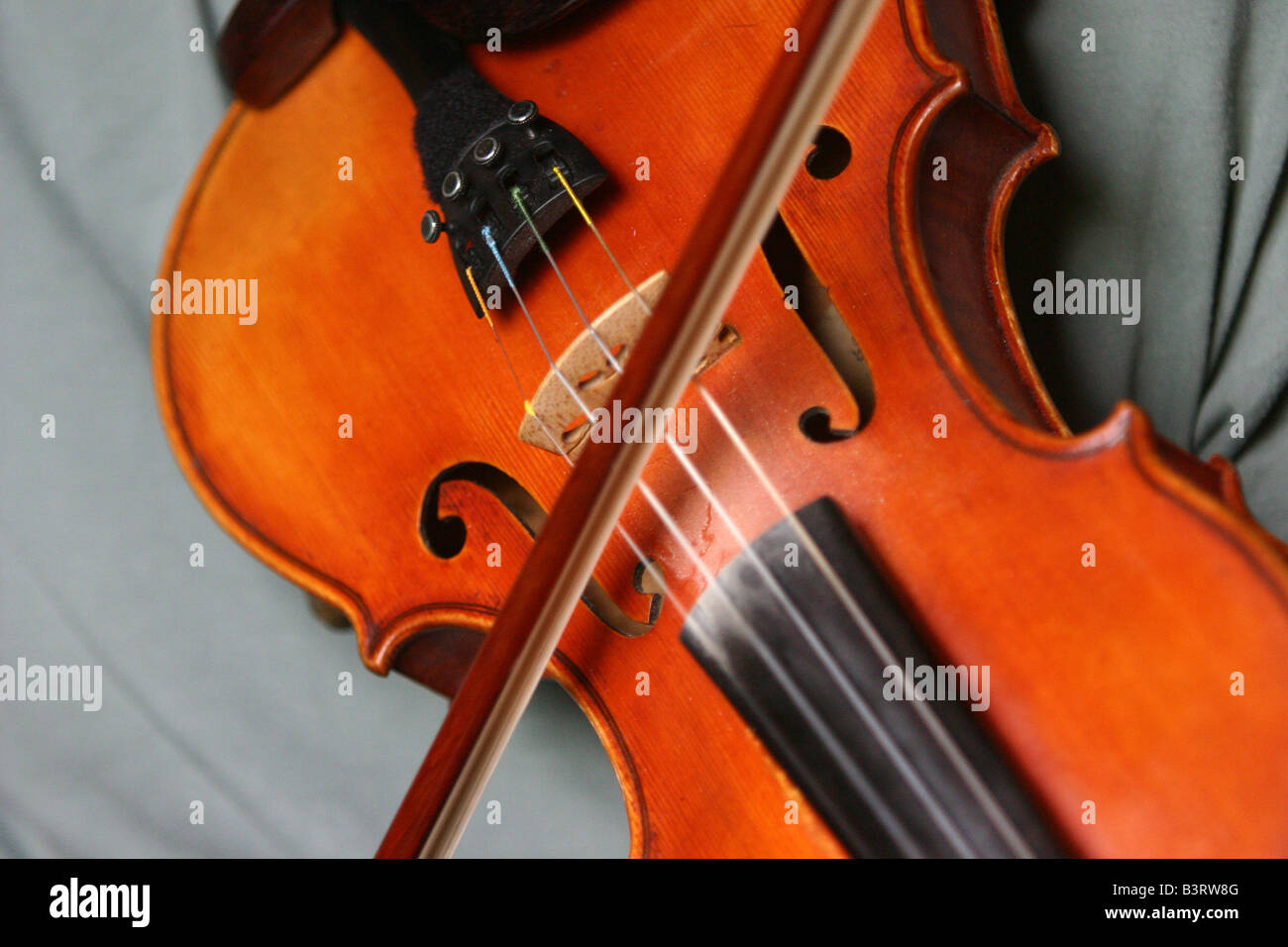 Musicians hands playing a fiddle Stock Photo