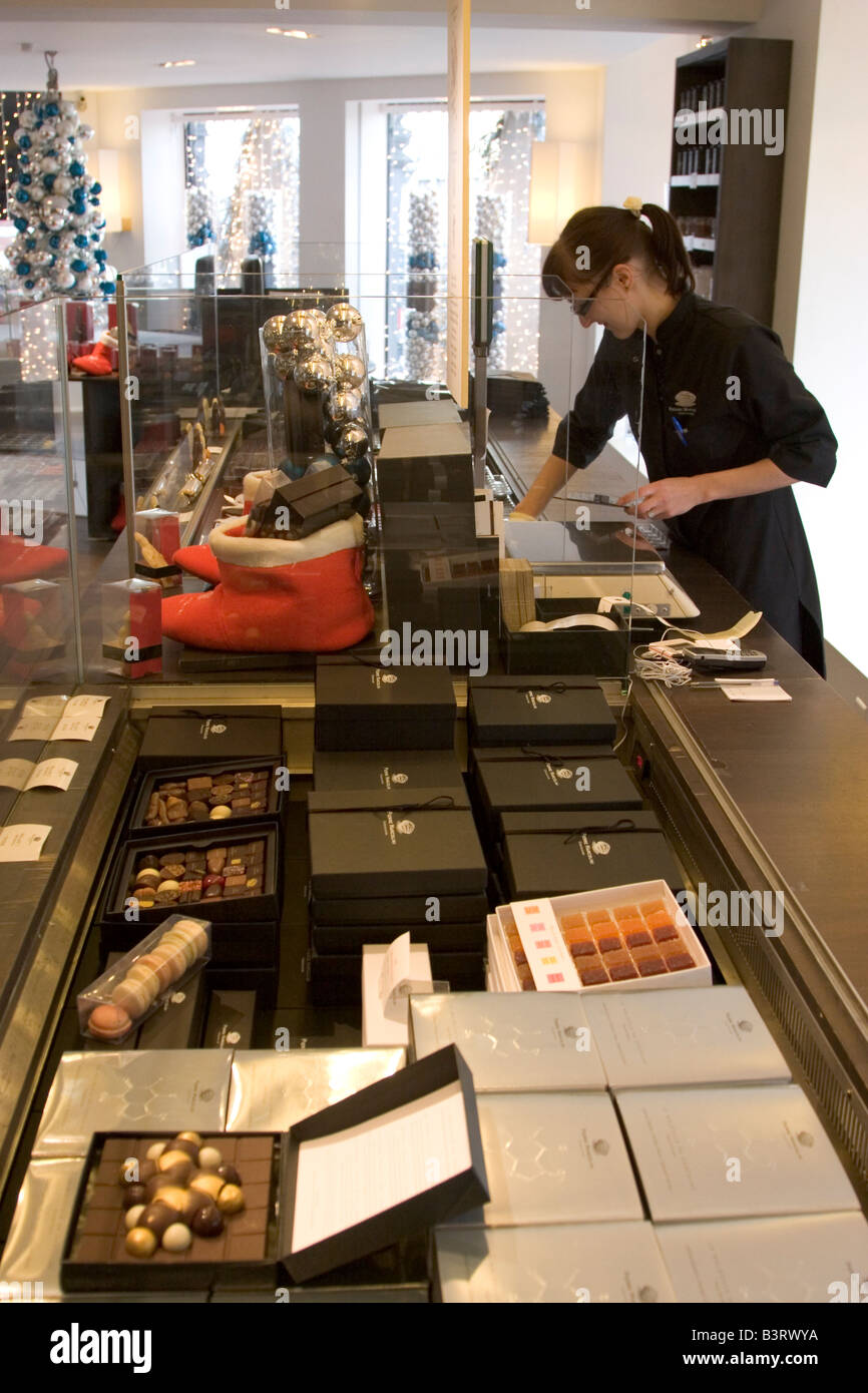 Huge choice and range of luxury Belgian chocolates displayed for sale at popular shop Pierre Marcolini in Brussels Belgium Stock Photo