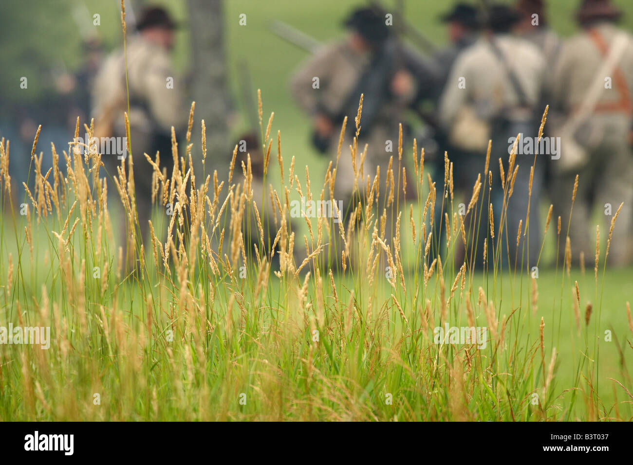 Confederate and Union soldiers face off during a battle at a Civil War Encampment Reenactment Stock Photo