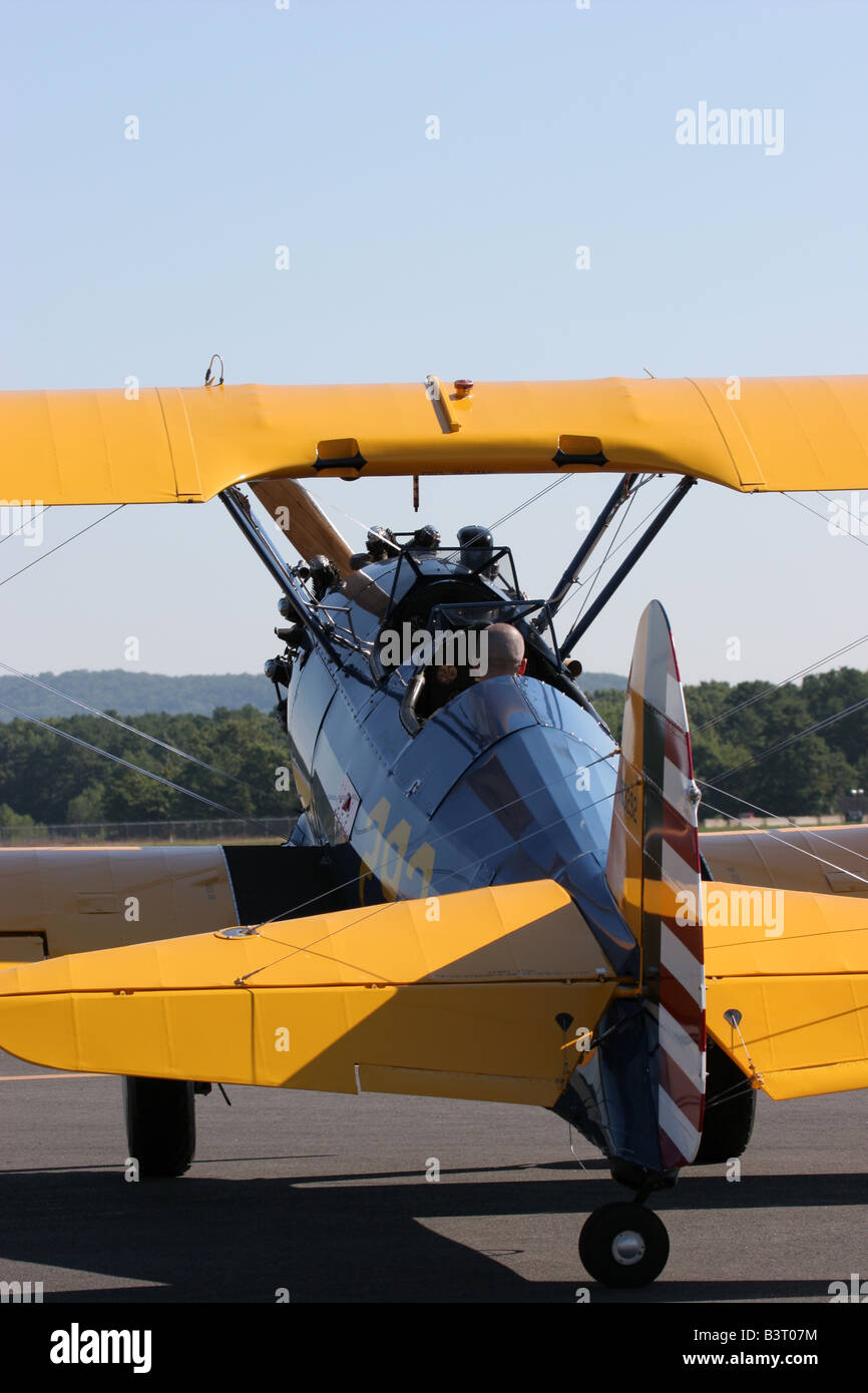 A PT 17 and pilot begin to taxi Stock Photo
