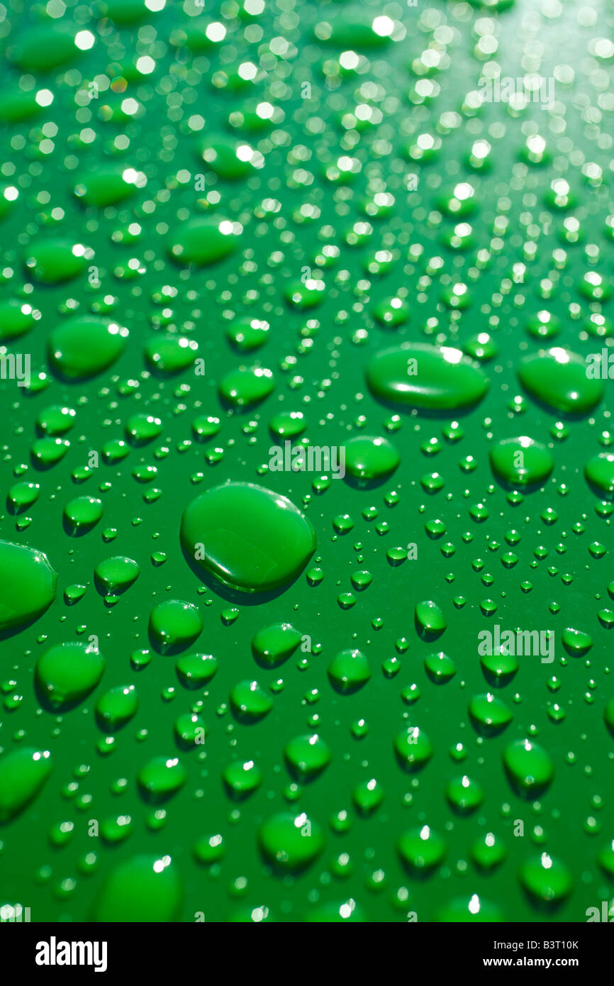 green tractor hood after rain Stock Photo Alamy