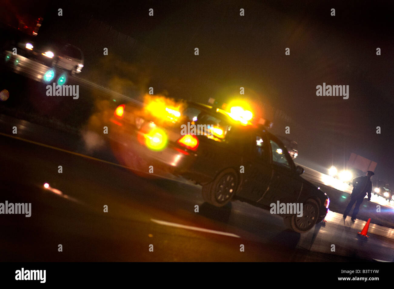 A highway patrol police car at an accident scene on a highway Stock Photo