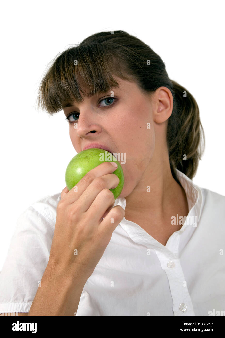 close up of woman eating apple on isolated background Stock Photo