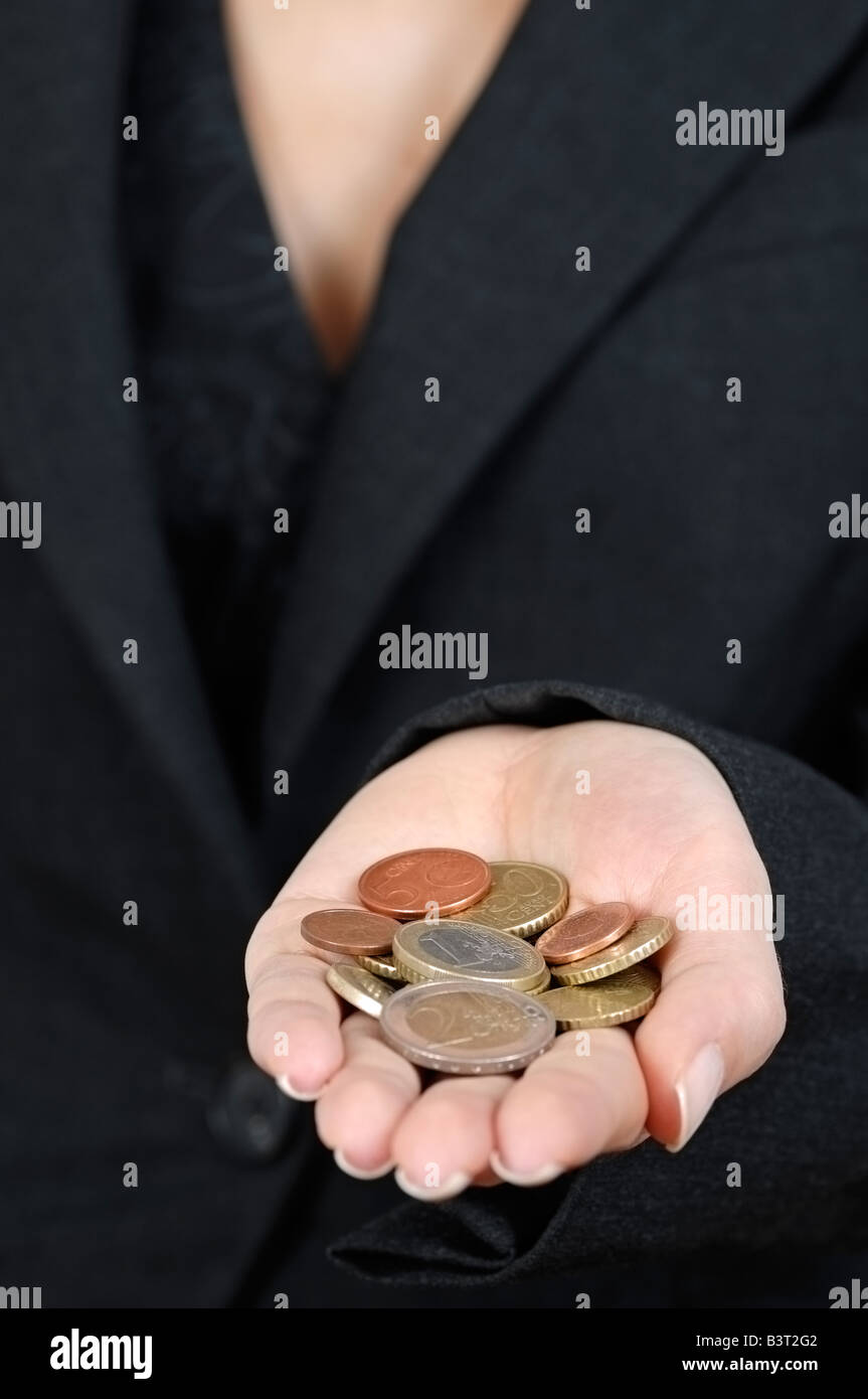 Woman Holding a Handful of Euro Coins Close Up Stock Photo