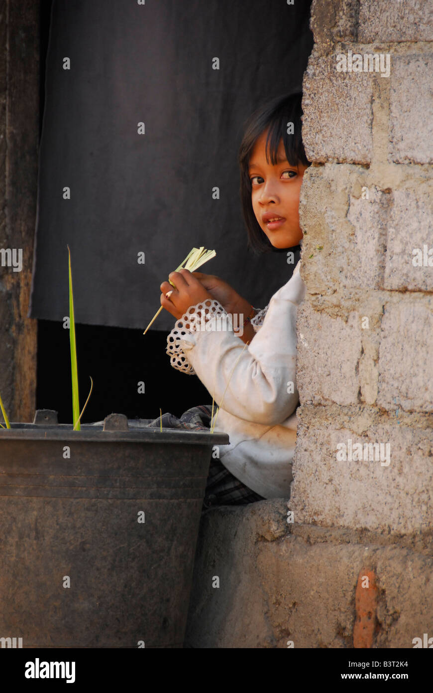 inquisitive child , julah, bali aga village , north bali , indonesia Stock Photo