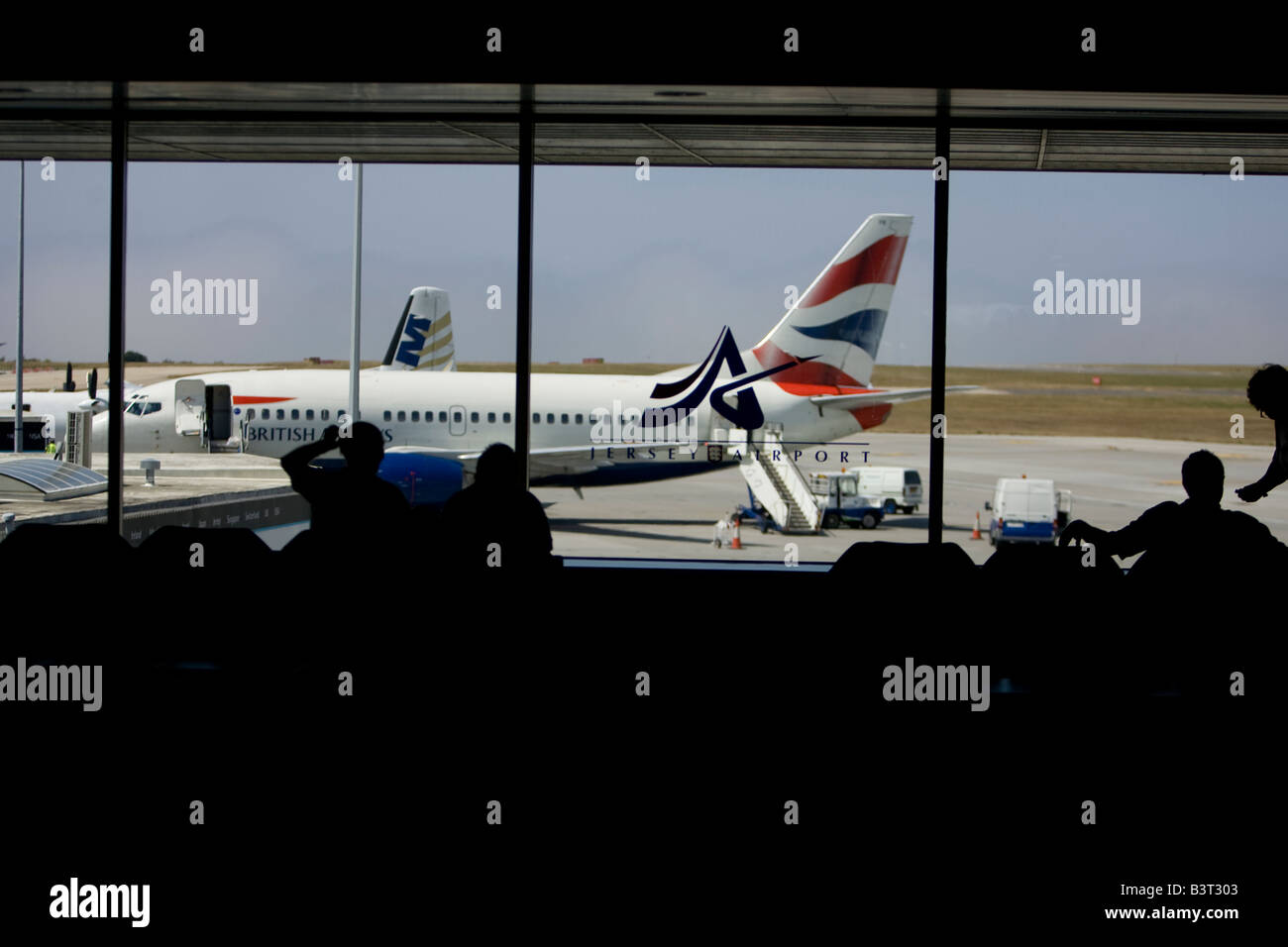 Jersey Airport Logo - Channel Islands -seen through arrivals & departures  window Stock Photo - Alamy