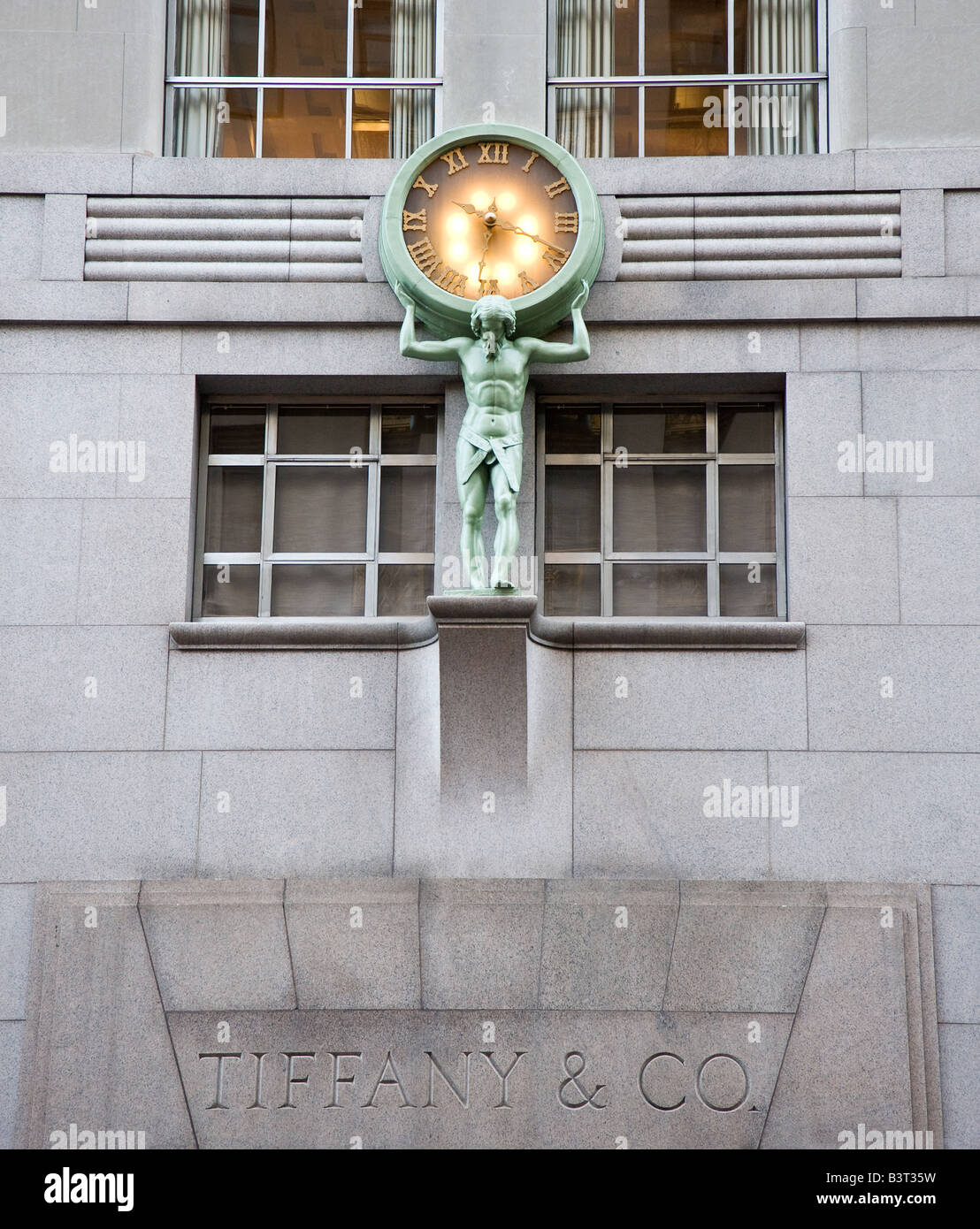 Statue and clock over the door at Tiffany, New York Stock Photo