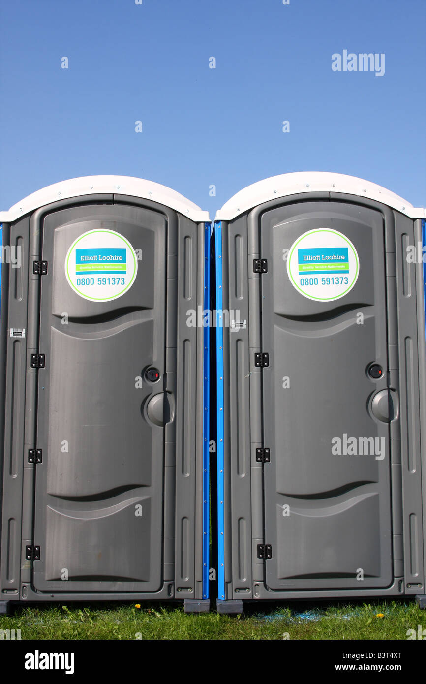 Portable toilet facilities at an outdoor event. Stock Photo