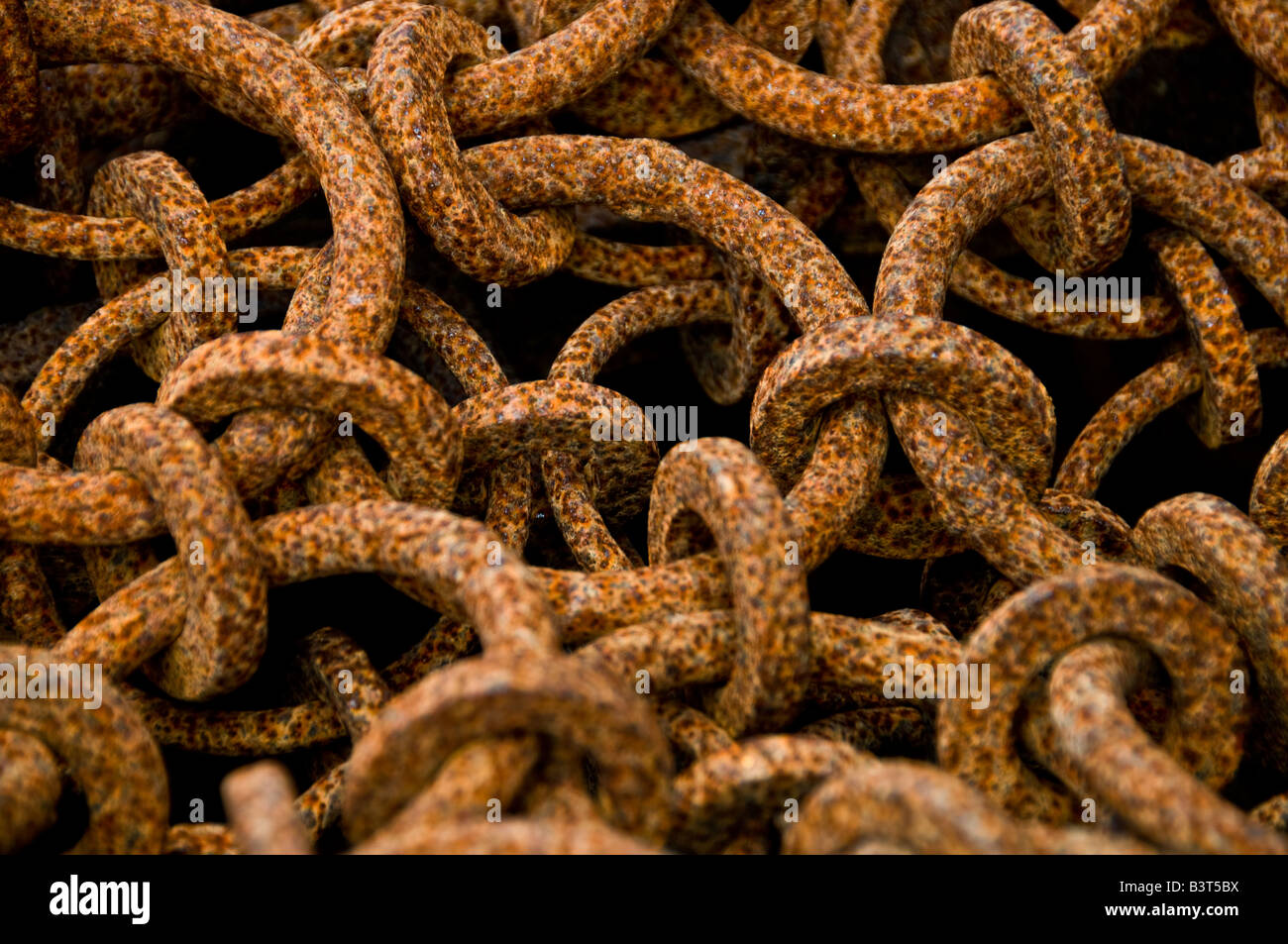 A pile of rusting chain links. Stock Photo