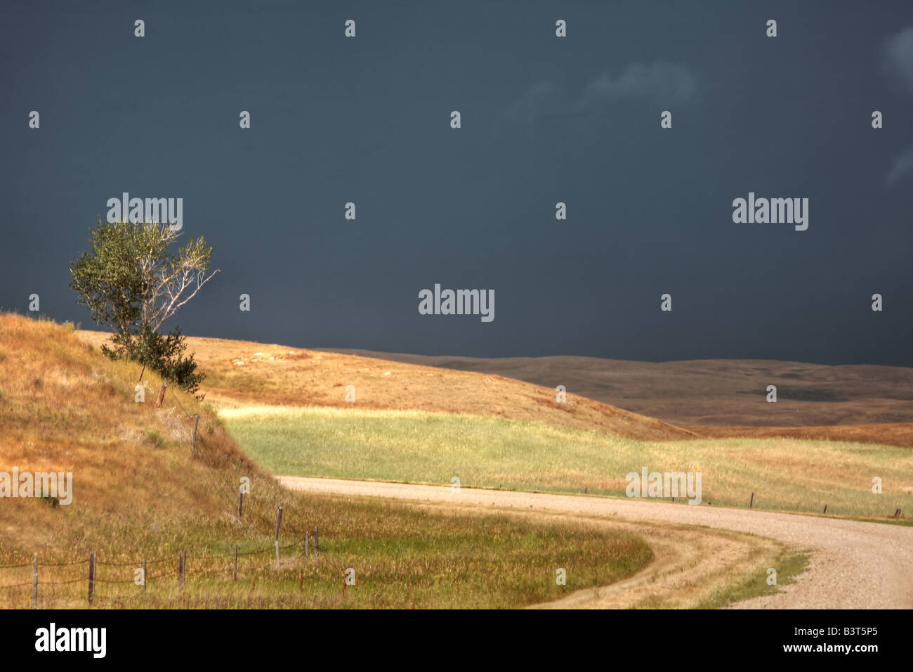 Storm clouds along a Saskatchewan country road Stock Photo - Alamy