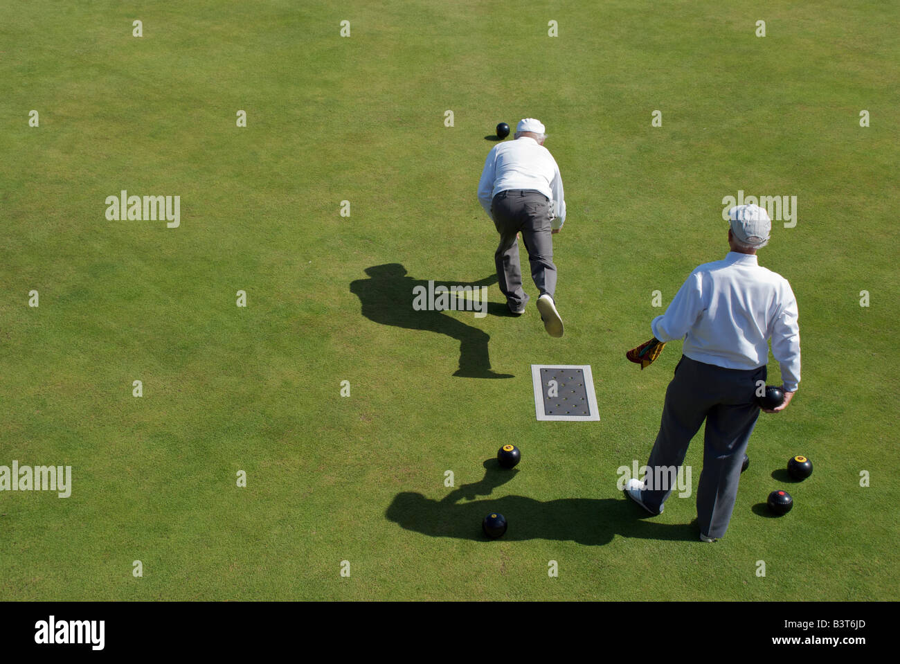 Senior males enjoying outdoor bowling Newquay Cornwall England Stock