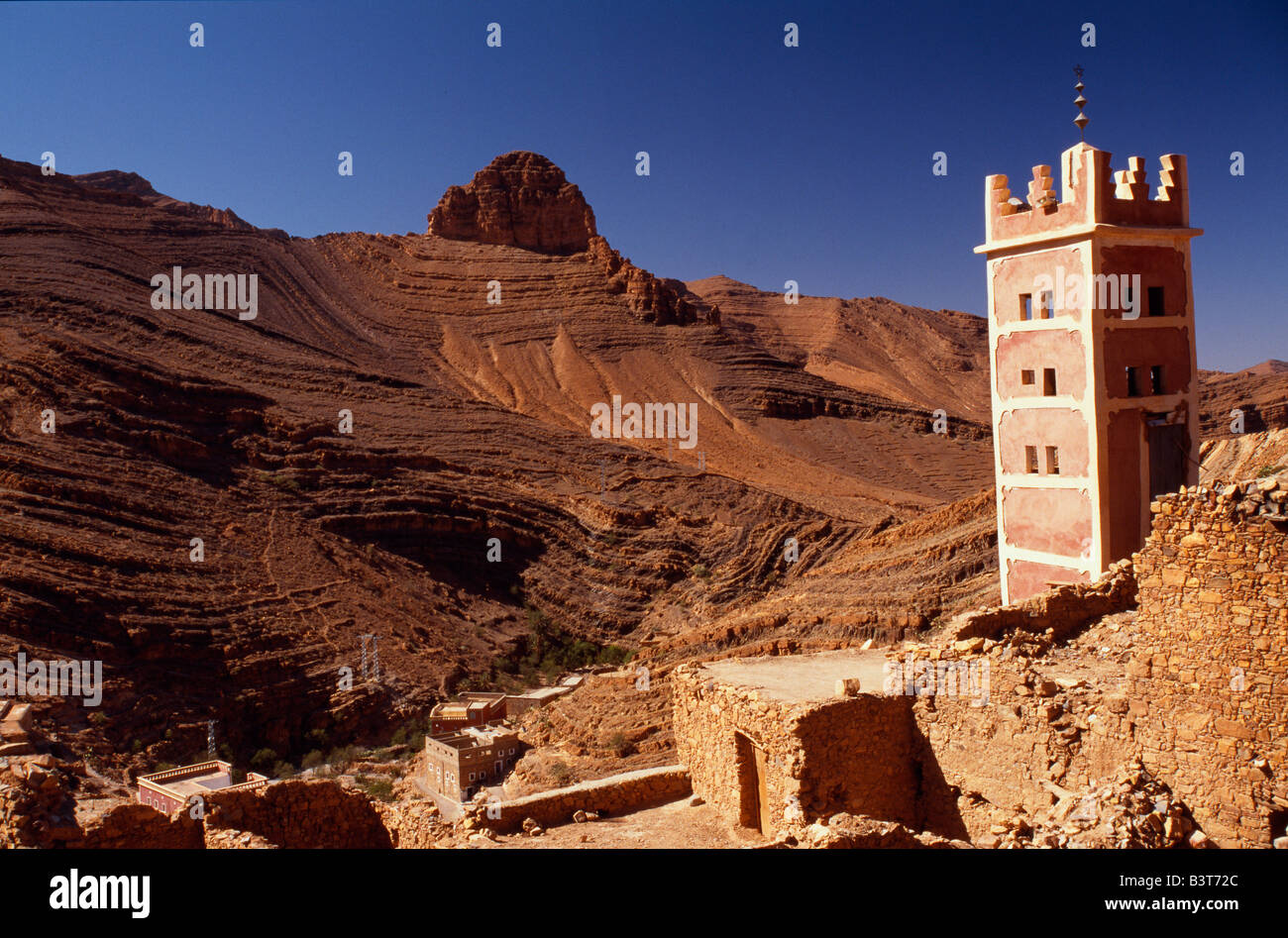 A minaret rises above a Berber village in the Anti-Atlas Mountains, Morocco. Stock Photo