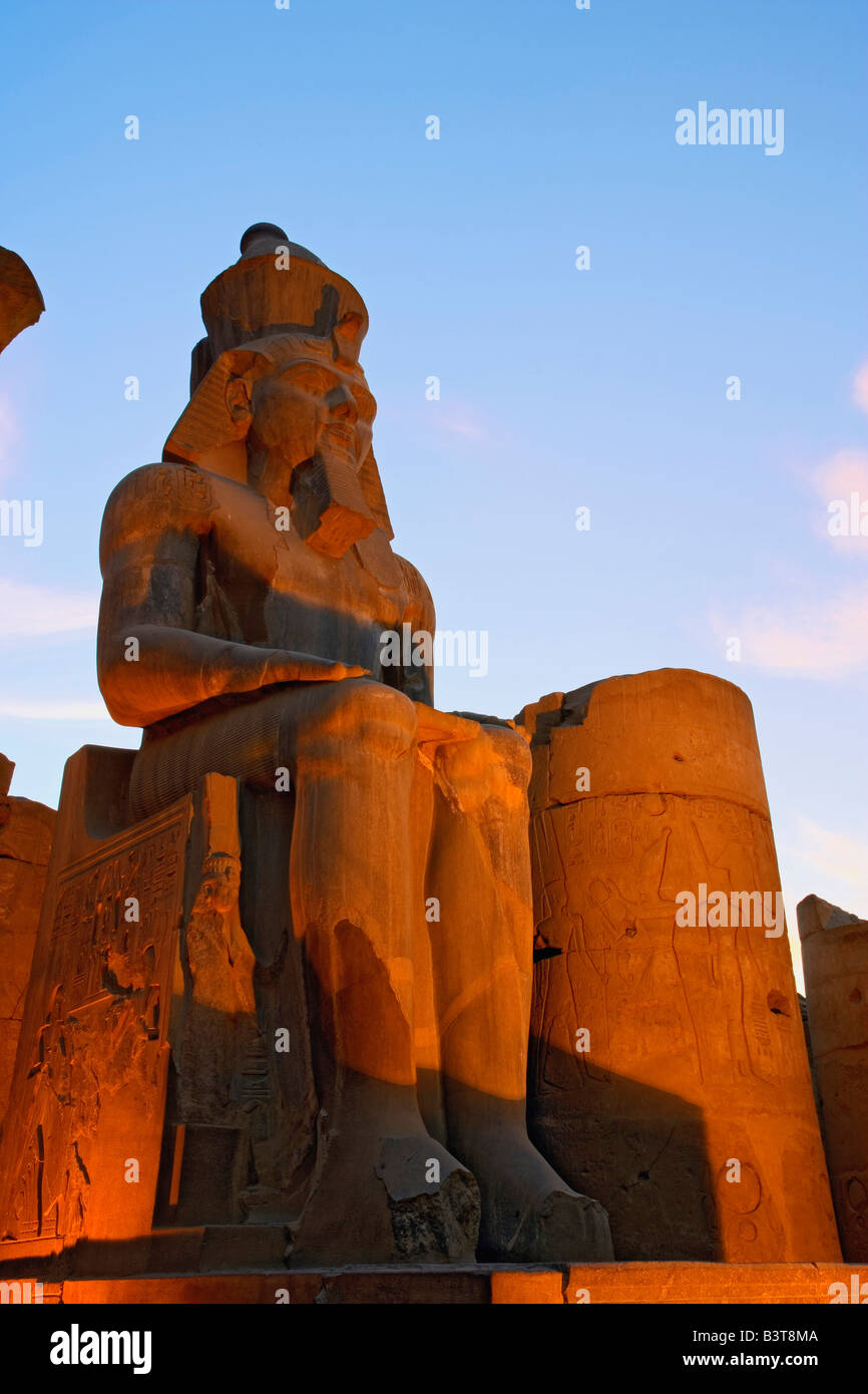 Statue of Ramses II at dusk, Luxor Temple located at modern day Luxor ...