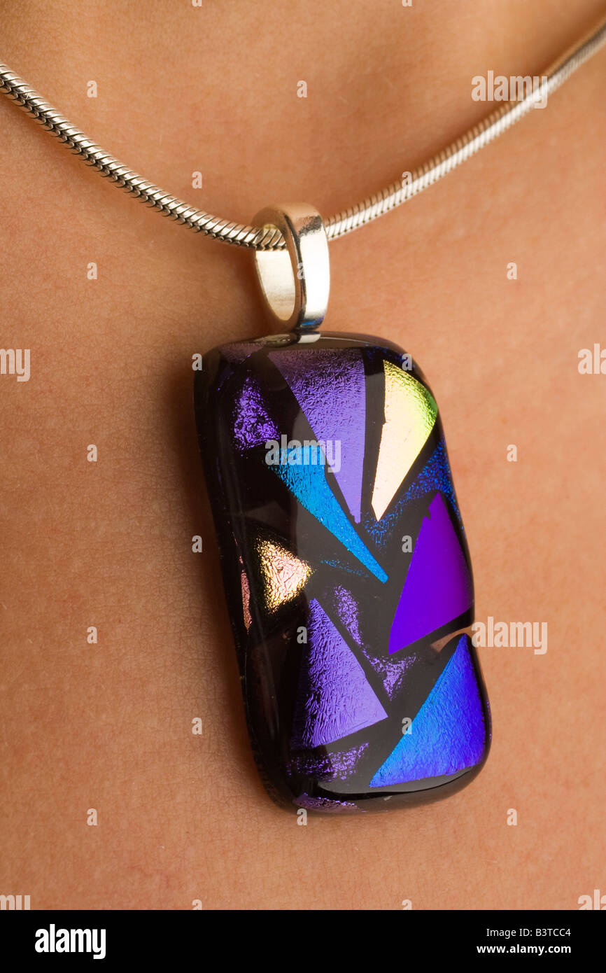 handmade coloured glass pendant jewellery using dichroic coatings Stock Photo