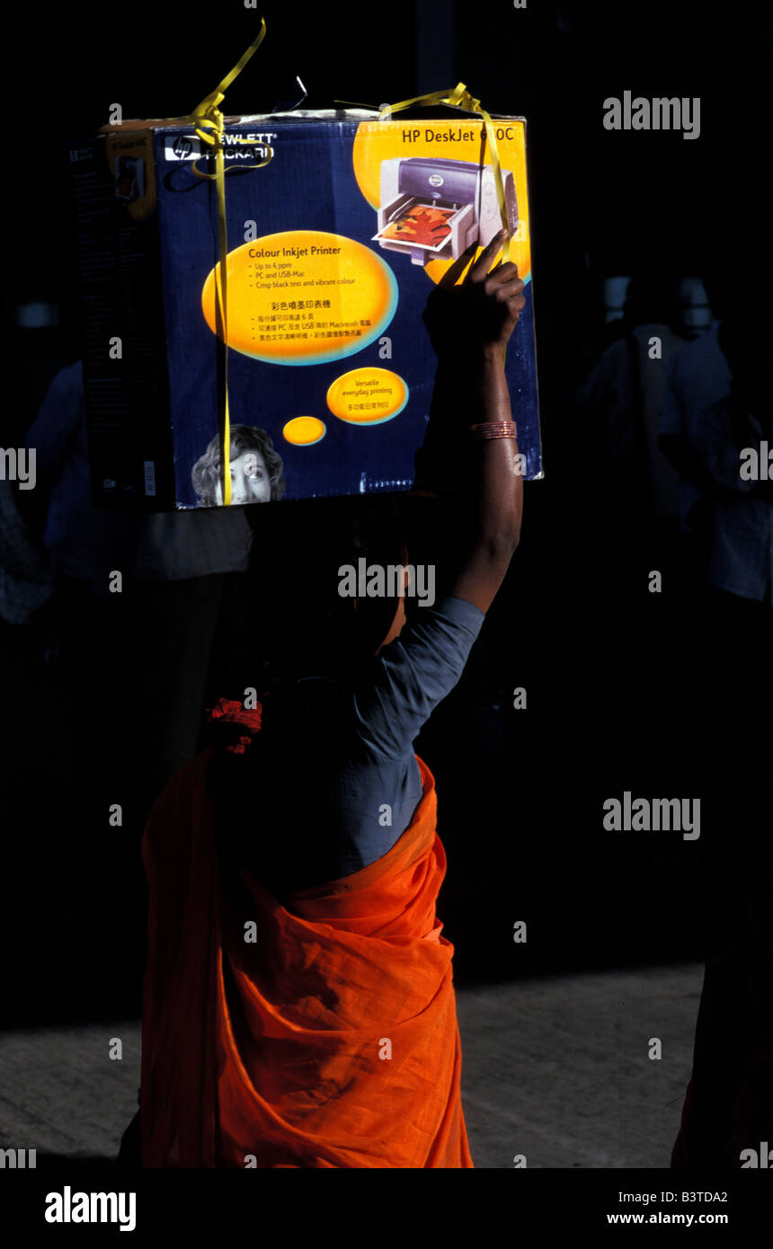 Asia, India, Bangalore. Bus stand crowds, woman with printer. Stock Photo