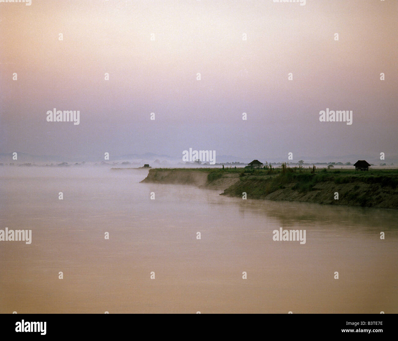 foggy evening atmosphere on the river banks of the Ayeryawady (Irrawady) Burma Birma Myanmar Stock Photo