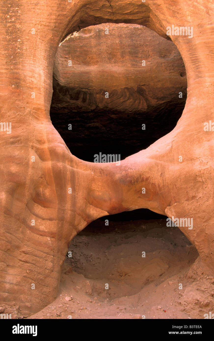 Asia, Jordan, Petra. Hole and arch in sandstone. Stock Photo