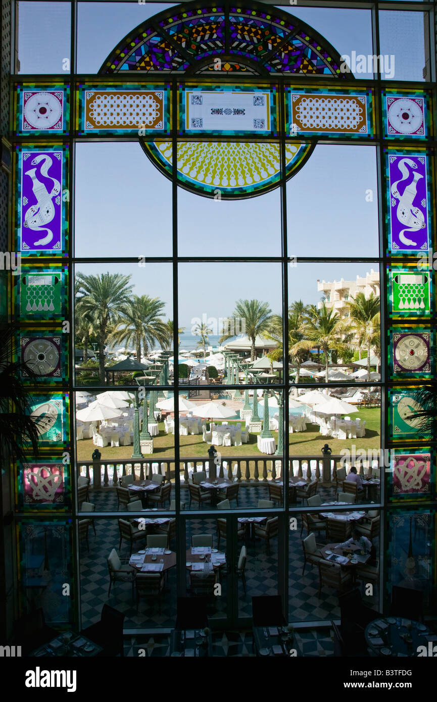Oman, Muscat, Shatti al, Qurm. Grand Hyatt Hotel. Courtyard View through Stained Glass Window Oman, Muscat, Shatti al, Qurm. Grand Hyatt Hotel. Courtyard View through Stained Glass Window