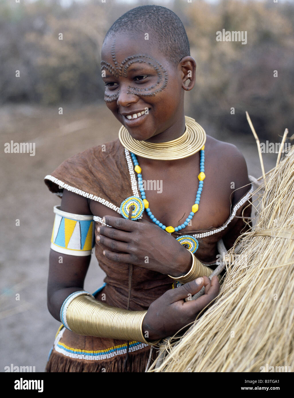 Tanzania Northern Tanzania Manyara A Datoga Woman Relaxes Outside Her Thatched House The 