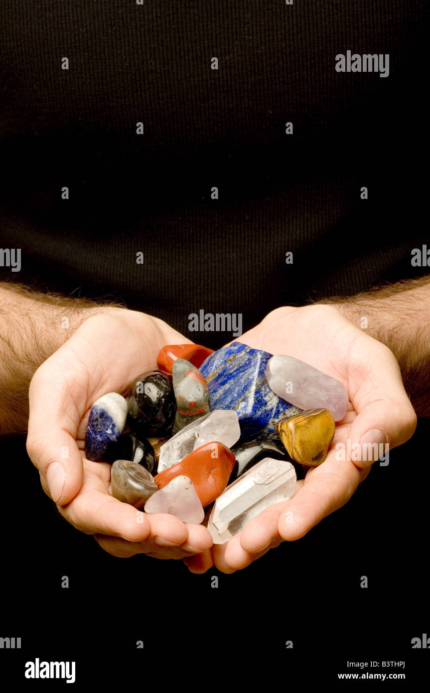 gemstones in the hands Stock Photo - Alamy