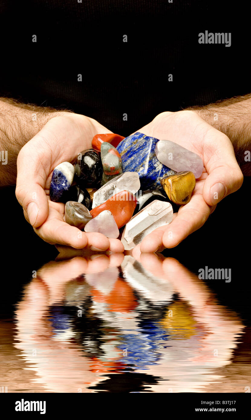 gemstones in the hands Stock Photo - Alamy