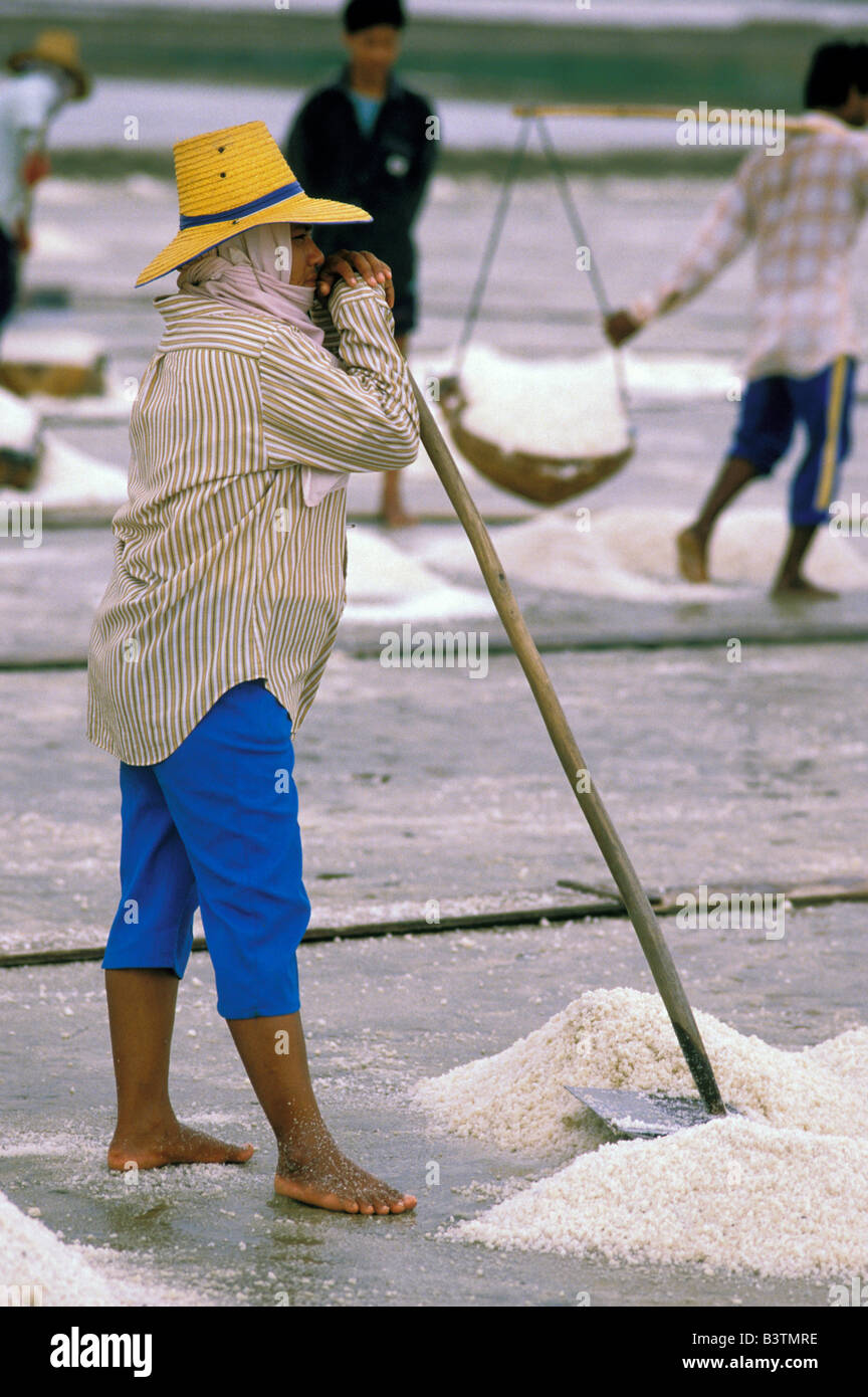 Asia, Thailand, Samut Songkhram. Worker at salt mines. Stock Photo