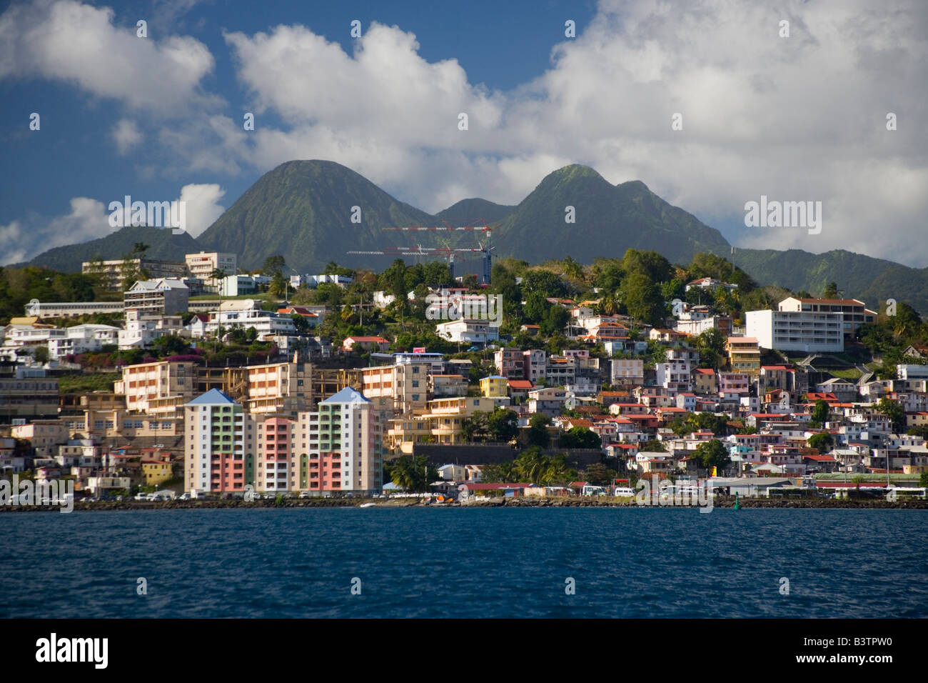 MARTINIQUE. French Antilles. West Indies. City of Fort-de-France below cumulus clouds. Stock Photo