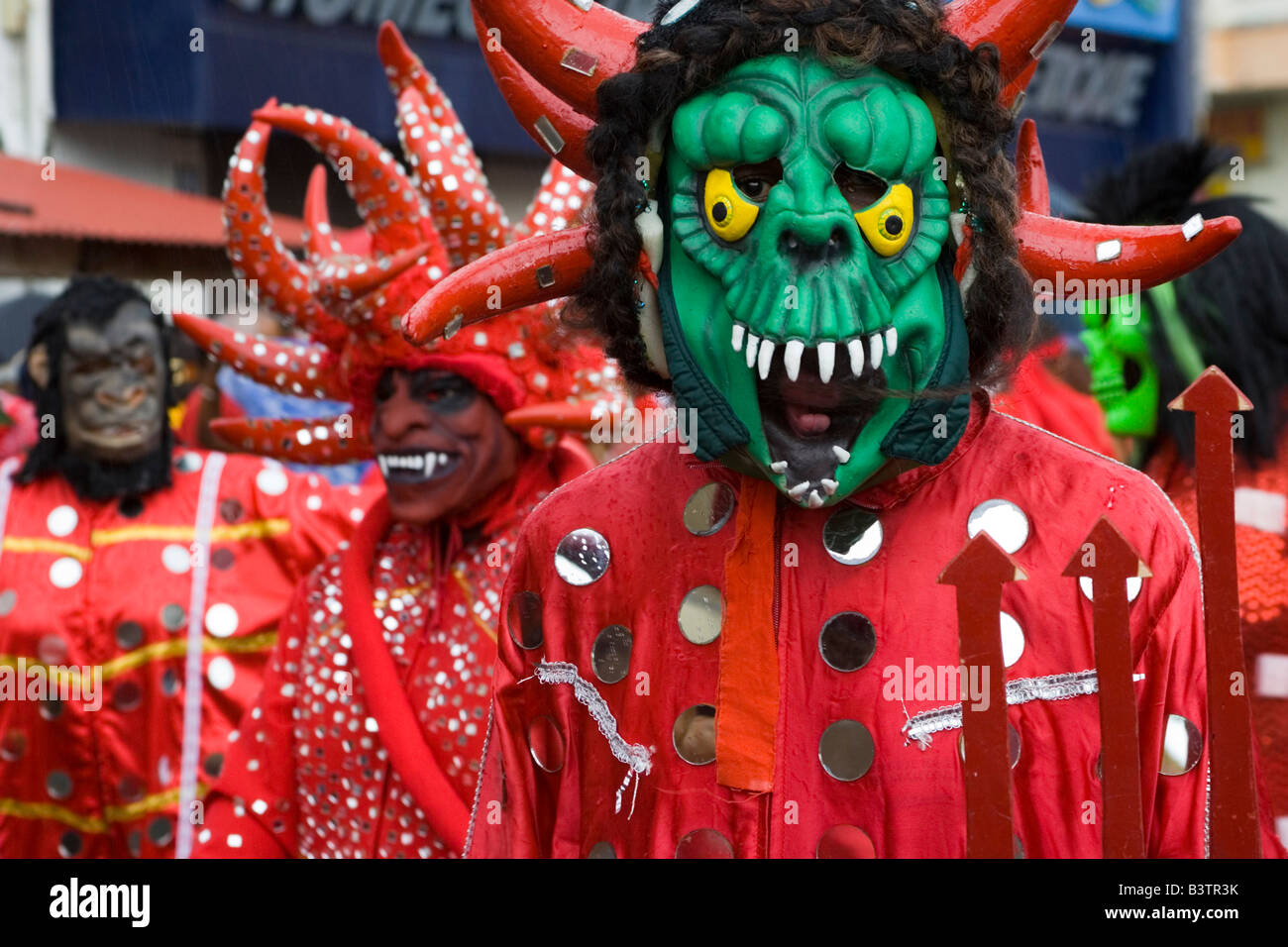 Red devils in parade during carnival hires stock photography and