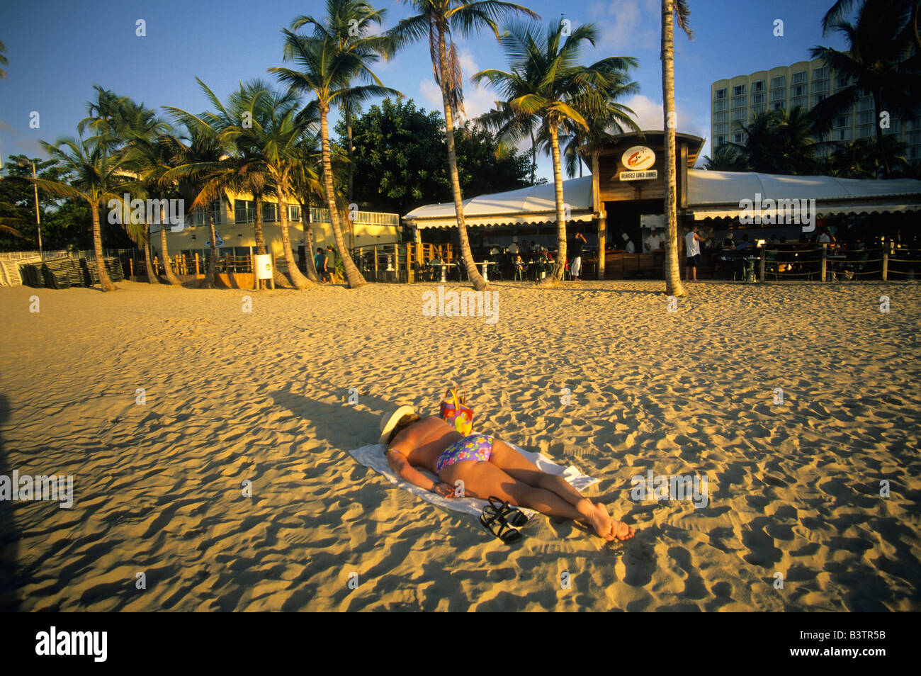 Sunbather on the beach in Isla Verde a resort area in San Juan Puerto ...