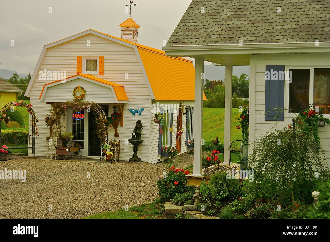 North America, Canada, Quebec, Saguenay,L'AnseSaintJean. Shop with bright metal roof Stock